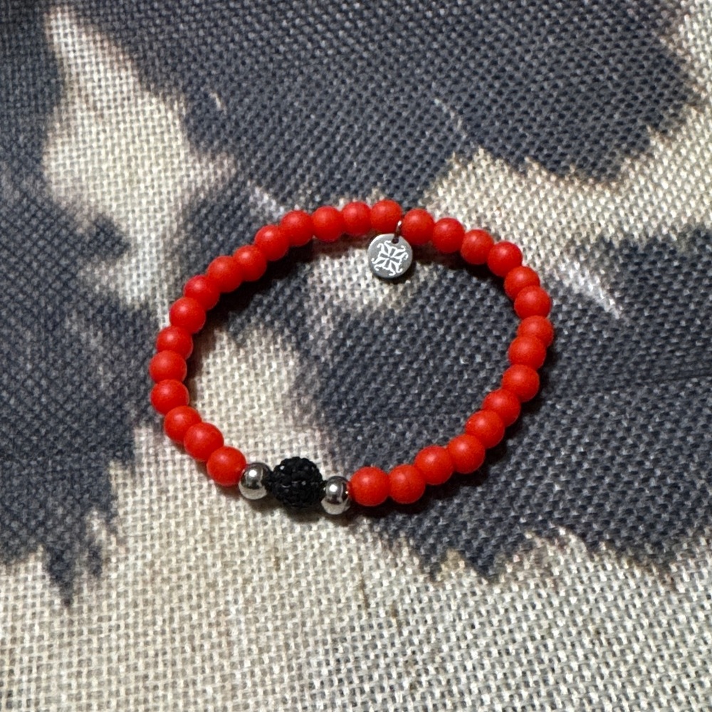 Vibrant Red Beaded Bracelet with Black and Silver Accents